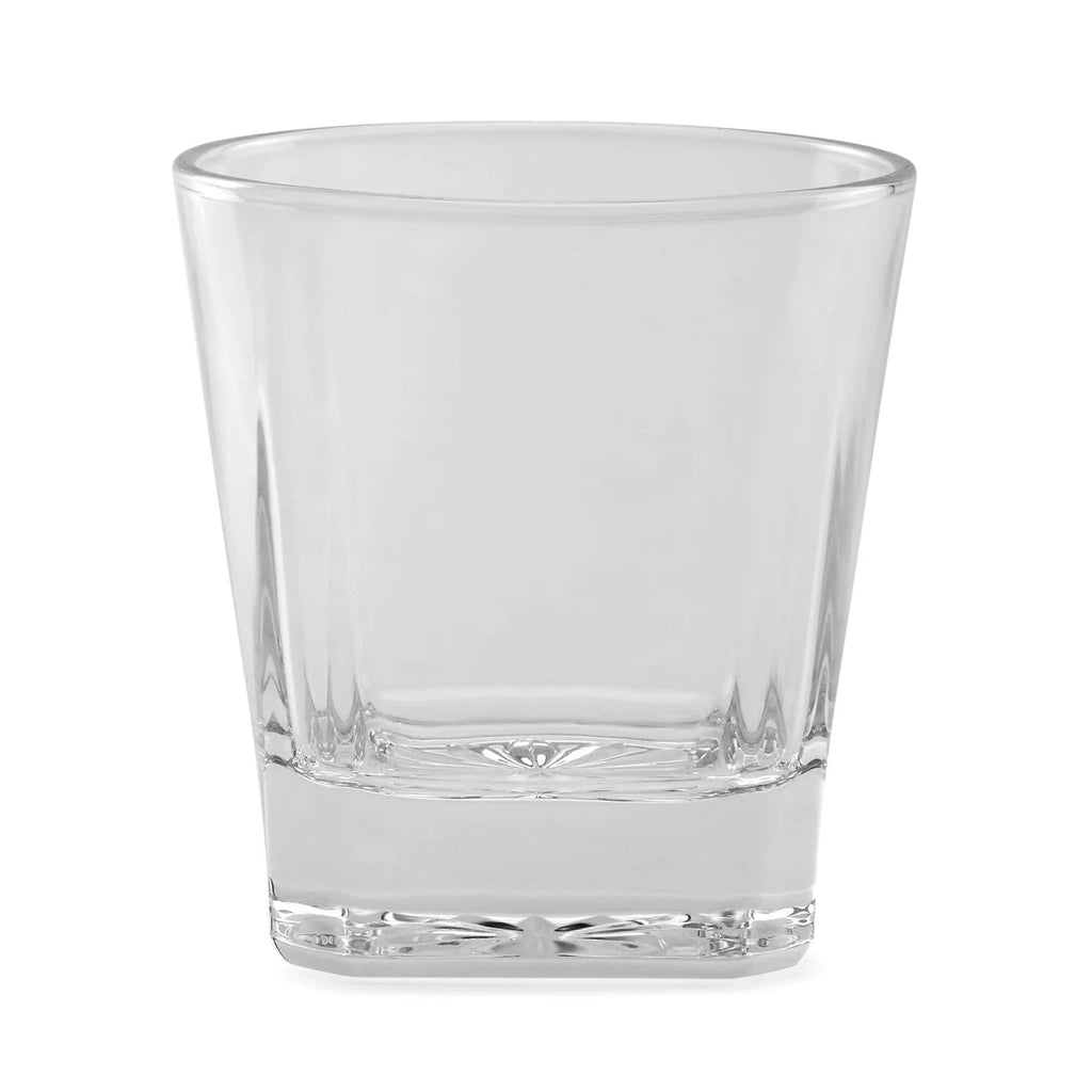 Single clear whiskey rocks glass on white background showing solid glass construction